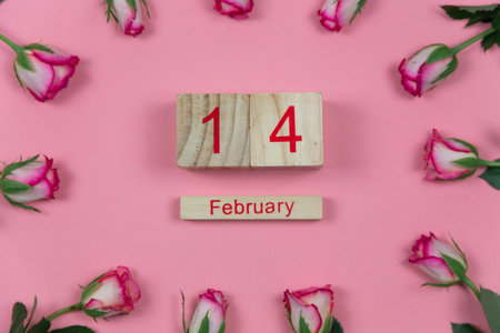 Roses with wine and wooden calendar on pink background February 14 Valentine's Dayの写真素材