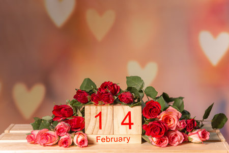 Pink roses on a wooden background, white place for text, easel, pink background for the holiday of February 14 or March 8, Valentines Dayの写真素材