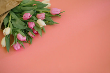 Tulips on a pink background for a Womens Day, Mother Day, 8 march or Valentines day. Close-up. The concept of holidays and good morning wishes.の写真素材
