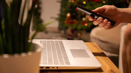 A man at home works at a computer, work from home, home environment with a computer, Homeoffice,...