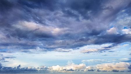 Cloudscape, Colored Clouds at Sunset near the Ocean, in a Cloudy Day