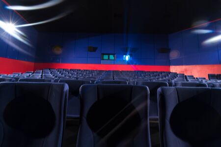 Cinema with empty seats and projector light.の写真素材