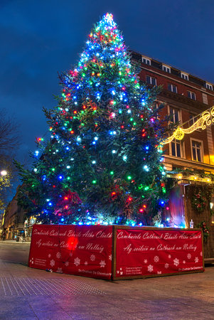 Dublin, Ireland - December 19, 2020: Festive lights of beautiful Christmas tree on the O'Connell Street and Henry Street in the early morningのeditorial素材