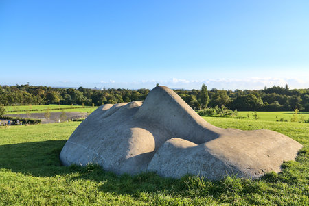 Dublin, Ireland - September 26, 2020: Beautiful view of sculpture "Dreaming About The Celestial Mountain" by Agnes Conway in Marlay Park on warm sunny autumn dayのeditorial素材