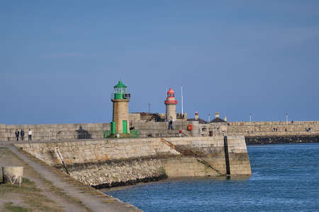 Beautiful evening view of red and green East and West Pier lighthouses in Dun Laoghaire harbor, Dublin. Ireland, Soft and selective focusの写真素材