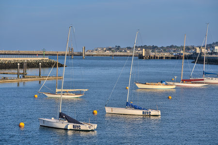Dublin, Ireland - April 24, 2021: Beautiful evening view of boat yachts on the water at Dun Laoghaire harbor. Soft and selective focusのeditorial素材