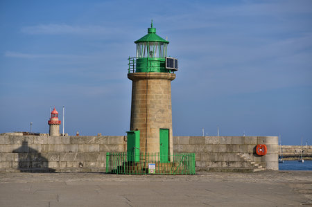 Beautiful evening view of red and green East and West Pier lighthouses in Dun Laoghaire harbor, Dublin. Ireland, Soft and selective focusの写真素材