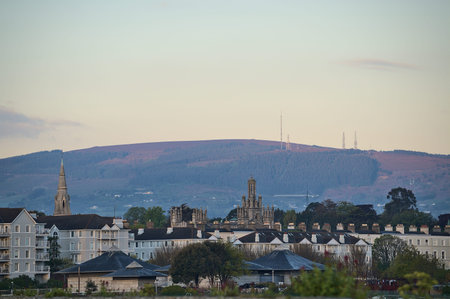 Beautiful morning view of roofs of houses, churches and castles, and Three Rock Mountain with...