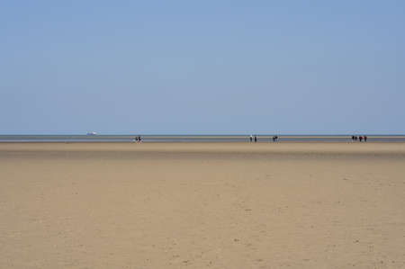 Beautiful bright view of Sandymount Beach, Dublin, Ireland. Walking people. Open spaces. High resolutionの写真素材