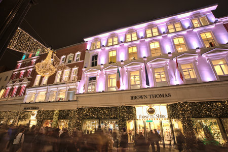 Dublin, Ireland - November 13, 2021: Beautiful evening wide angle view of Brown Thomas hotel decorated with Christmas lights on Grafton Street. Crowded street during COVID pandemic and Christmasのeditorial素材