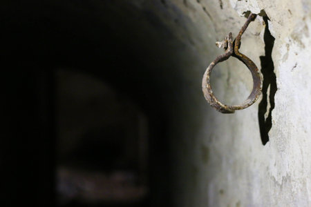 old hand chains in castle basementの写真素材