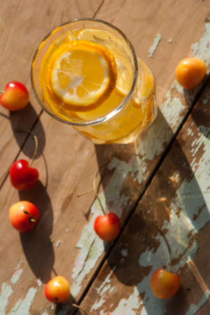 Lemonade and Cherries in summer evening sunlight.の写真素材
