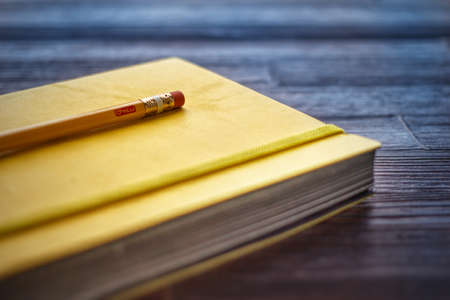 sketchbook and pencil on a tableの写真素材