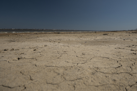cracked earth. blue sky. backgroundの写真素材