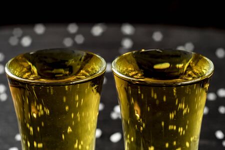 two glasses of tequila with lime and saltの写真素材