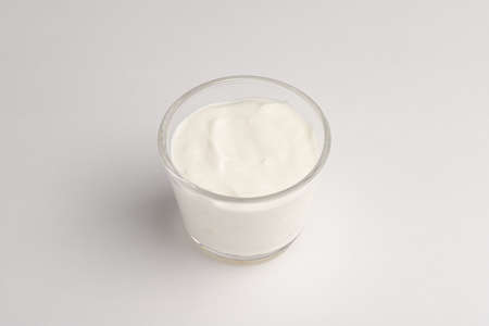 sour cream in a transparent bowl, white sour cream, on a white background, isolatedの写真素材