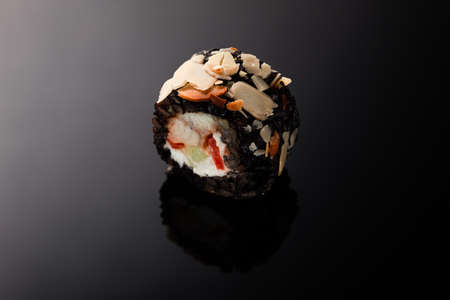 Sushi with eel on a black background with reflection. Macro photography.の写真素材