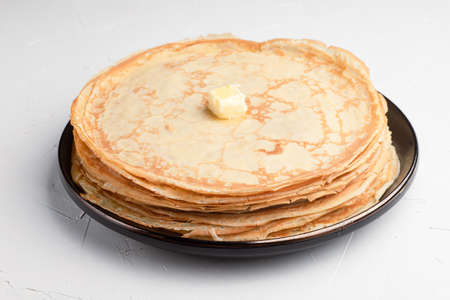 A stack of delicious pancakes on a white background, Russian cuisineの写真素材