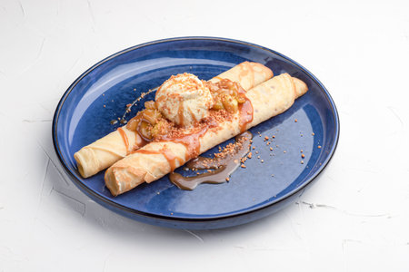 Pancakes with ice cream, sweet pancakes on a white background, Russian cuisine.