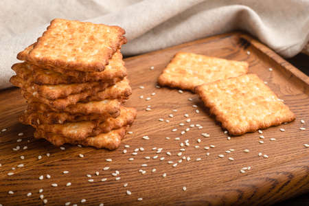 Sesame cracker, cracker, cookie cracker on different backgrounds.の写真素材