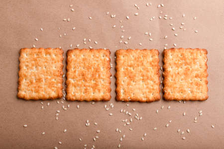 Sesame cracker, cracker, cookie cracker on different backgrounds.の写真素材