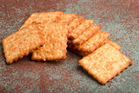 Sesame cracker, cracker, cookie cracker on different backgrounds.