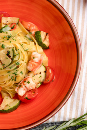 Pasta with shrimp, pasta with seafood on a white wooden background, top viewの写真素材