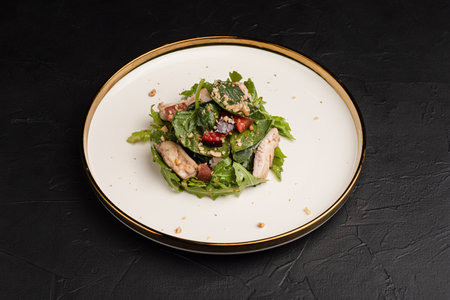 salad, salad of fresh vegetables and herbs on a black background side viewの写真素材