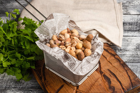 Nuts, different nuts for beer on a wooden white background