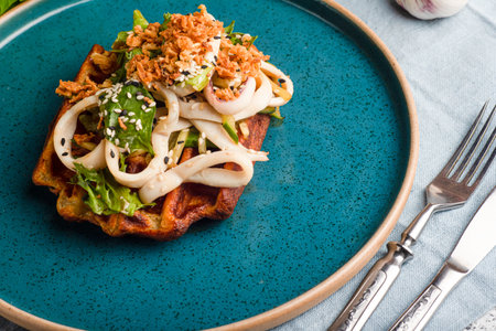 Waffles with squid, waffles with squid and vegetables on wooden whiteの写真素材
