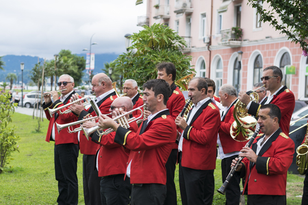 musicians in red tunics play on different instruments in the streets of Batumi.
Photo taken on 02.09.2017, Festival Batumoba2017, Batumi. Georgia.のeditorial素材