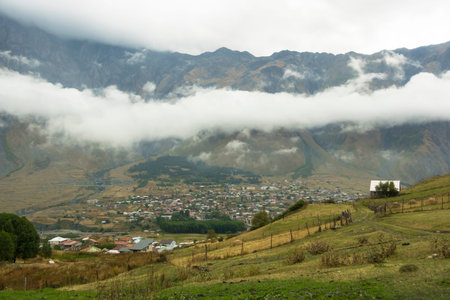 View of Caucasus Mountains and Stepantsminda town(formerly Kazbegi). Georgia. photo taken on...