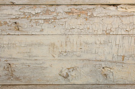 old grey wooden door peeling paint textureの写真素材