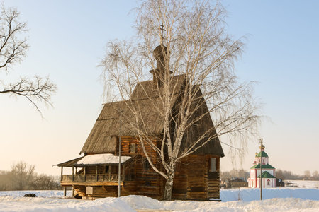 Beautiful old wooden orthodox Christian church in winter dayの写真素材
