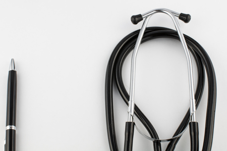 pen and stethoscope on white background close copy spaceの写真素材