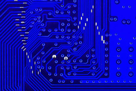 Electronic circuit board as an abstract background pattern. Macro close-up toned.