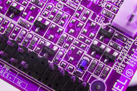 Chip on motherboard mainboard with controllers, ports and wires, close-up macro toned.の写真素材