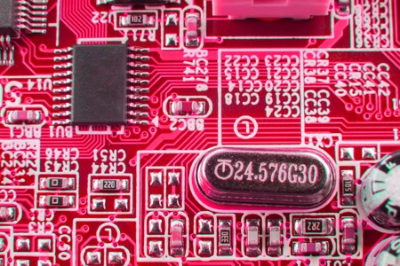 Chip on motherboard mainboard with controllers, ports and wires, close-up macro toned.の写真素材