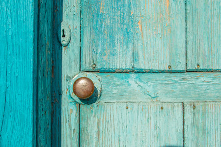 Old blue wooden door with brass handle Round.