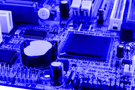 Electronics components on modern PC computer motherboard with RAM connector slot and CPU Socket.の写真素材
