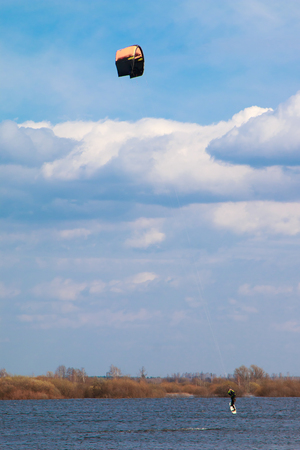kitesurfing in the flooded meadows during the high water on a bright sunny dayの写真素材