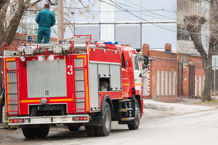 a fire truck is standing on the streetの写真素材