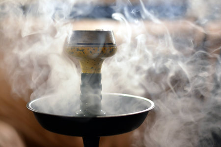 a bowl of tobacco in a cooked hookah in the smoke
