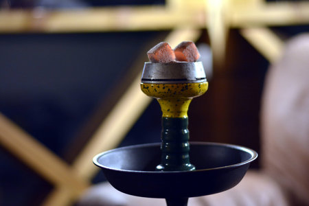 a bowl of tobacco and a saucer with hot charcoal, a ready hookahの写真素材