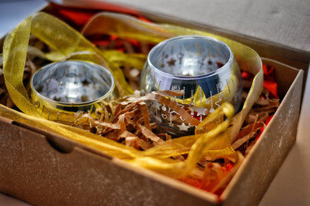 golden candlesticks with stars in a gift boxの写真素材