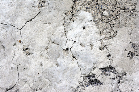 abstract texture of a cracked gray concrete wall.の写真素材