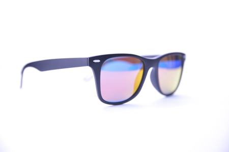 Black-rimmed sunglasses with rainbow glasses on a white background isolated.の写真素材