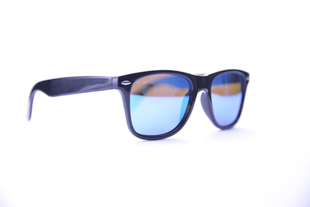 Sunglasses in a black frame with blue glasses on a white background, isolated.の写真素材