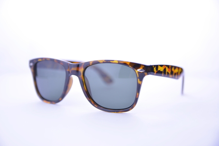 Leopard-rimmed sunglasses with dark glasses on a white background, isolated.の写真素材
