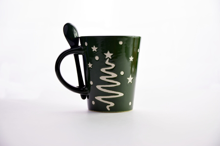 Happy New Year Green ceramic cup isolated on a white background.の写真素材